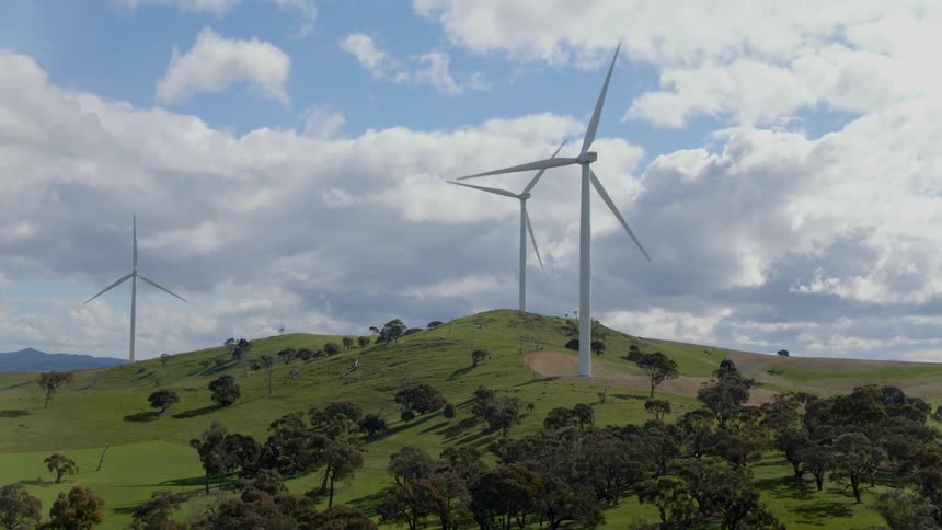 The hills have three wind turbines