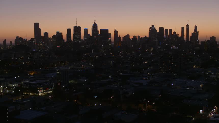 A city skyline at sunrise