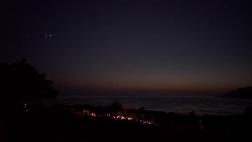 The sun is setting over this camp below
