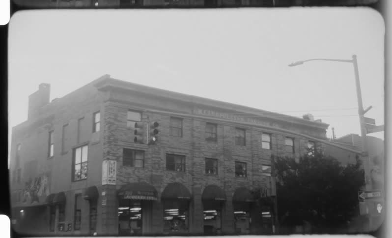 Old brick building with a sign on the facade