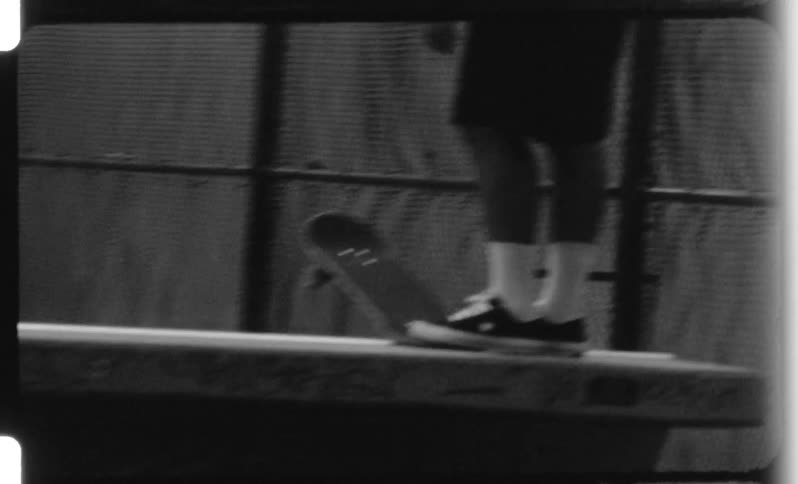 A group of people skateboarding at a skate partk