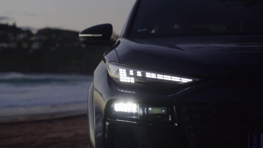 The car is parked on the beach