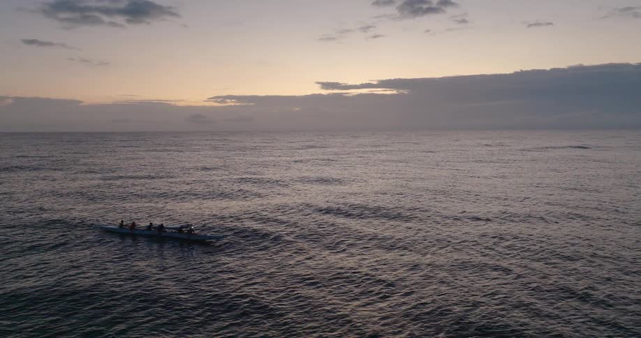 A view of people rowing a kayak