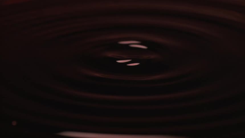 The liquid slowly spins in a circle