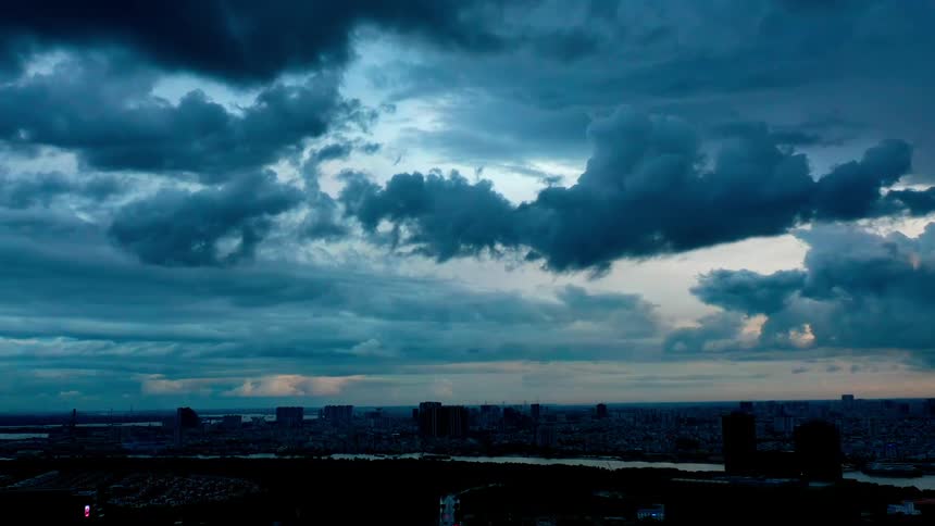 Cloudfilled sky with dark clouds over an urban area at dusk