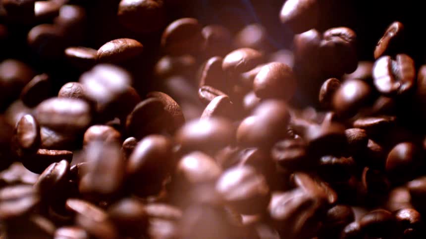 Series of coffee beans toss into flames