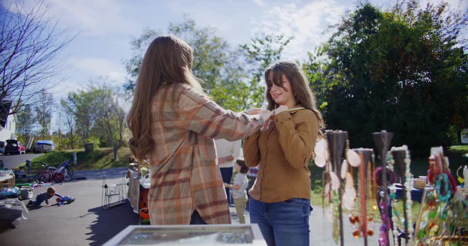 People are browsing items at a yard sale