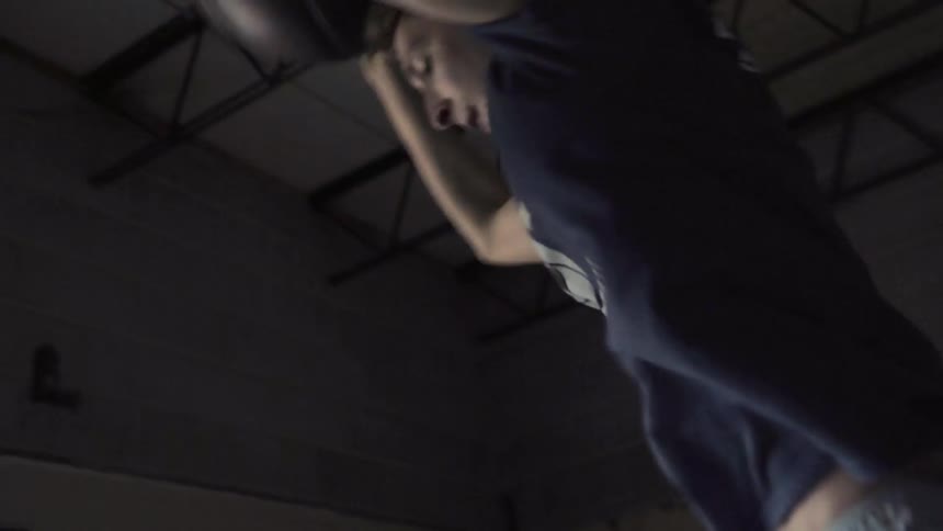 A man exercises with a weight ball