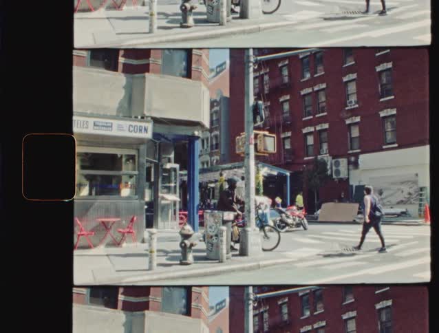 Pedestrians travel in the intersection of the city