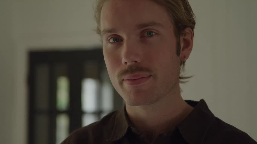 A portrait of a man in a room