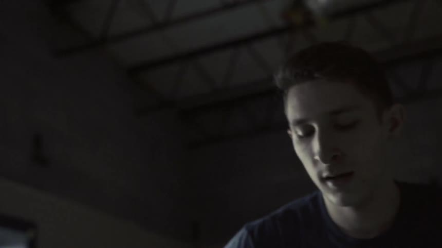 A man looks around breathing heavy