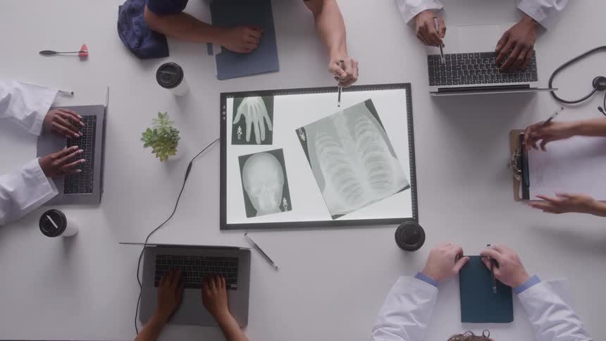 A group of people using laptops to do work