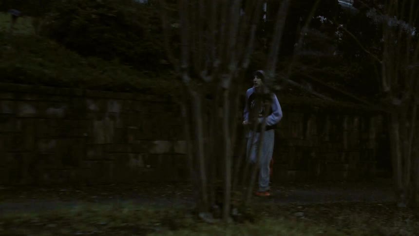 Man jogging down neighborhood sidewalk at dawn