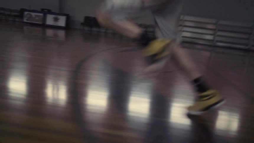 A player races down the court