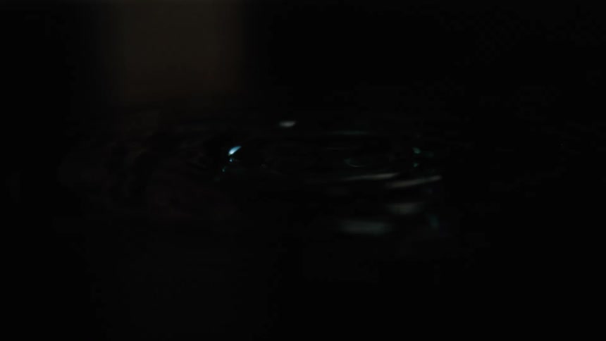 The drop of water creates a ripple when it falls