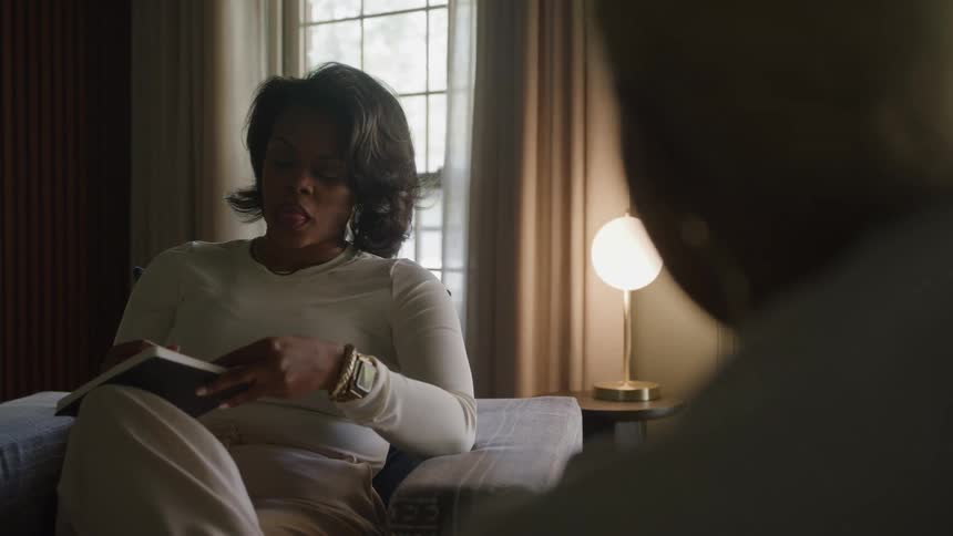 A black female therapist conversing with a female patient while sitting in an office during daytime