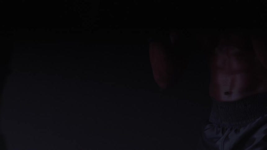 Boxers in action with focus on gloves and muscles highlighted by dramatic lighting