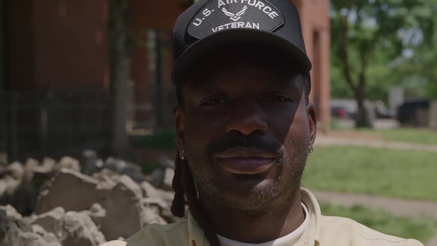The man is wearing an veteran cap
