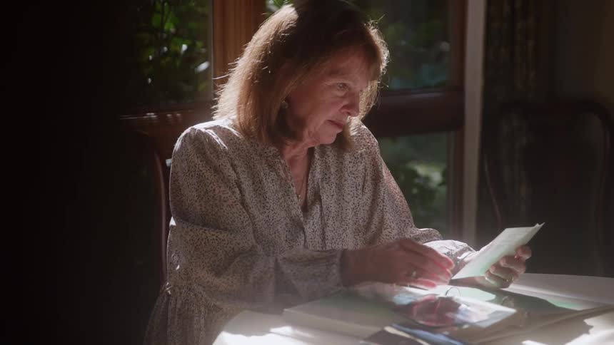 Woman viewing photos at home