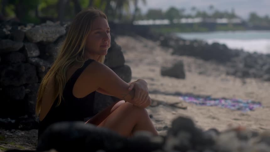 A portrait of a woman out on a beach
