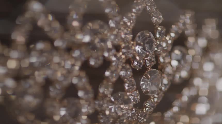 A necklace adorned with diamond stones sparkles brilliantly its elegant design showcasing luxury and refinement