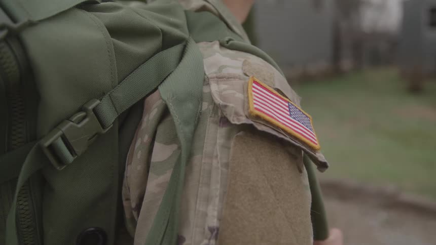A portrait of a person wearing military clothing