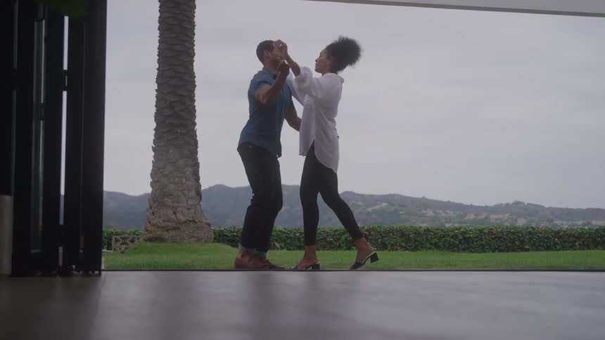 A man and woman hugging each other after proposing