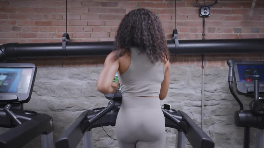 Woman running on a treadmill working out
