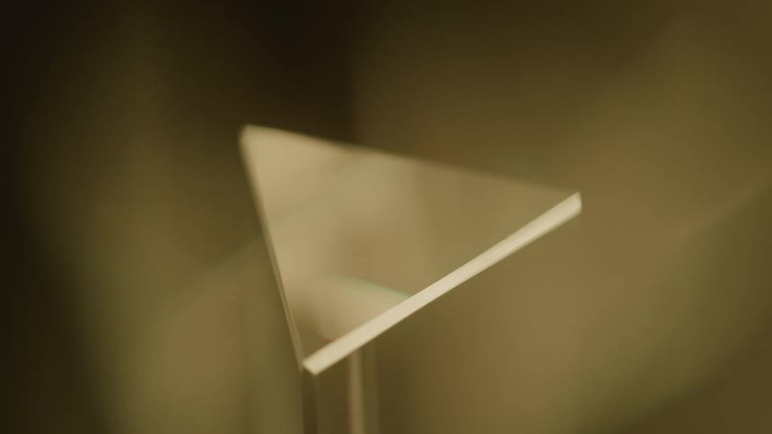 Transparent glass panel resting on a stand in a blurred environment