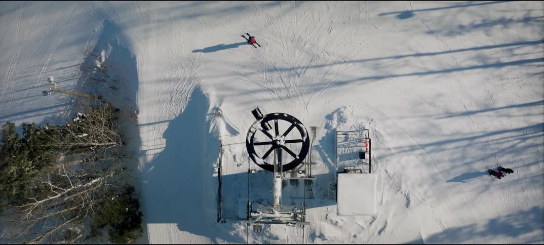 Ski lift station over a snowcovered area seen from above