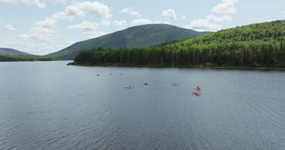 Several kayakers on a lake