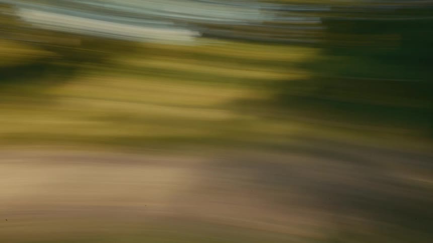 Fast motion creating a horizontal blur with dark and yellow tones
