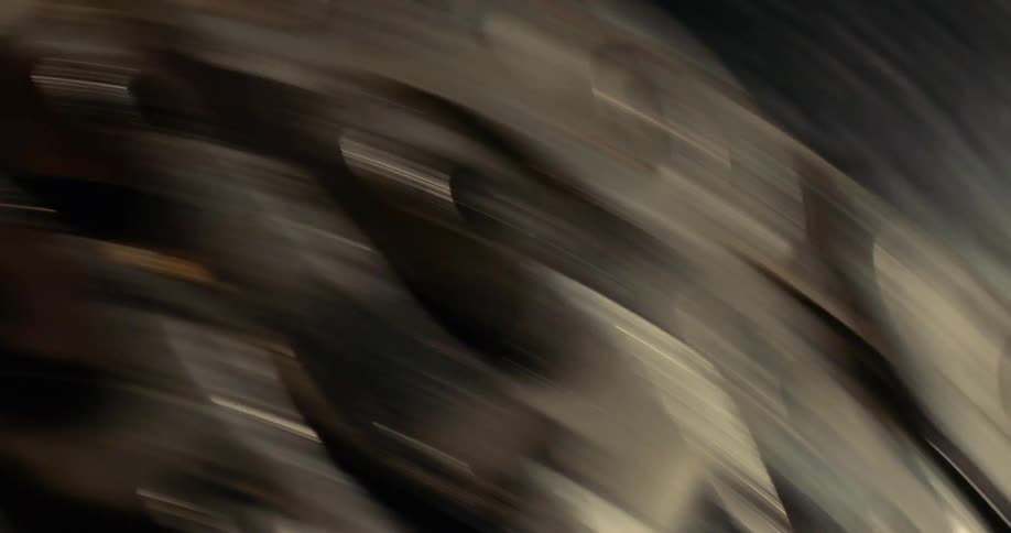 A metal chain spinning rapidly around its own axis