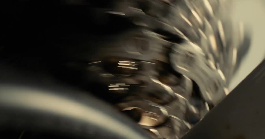 The bicycle chain spins fast