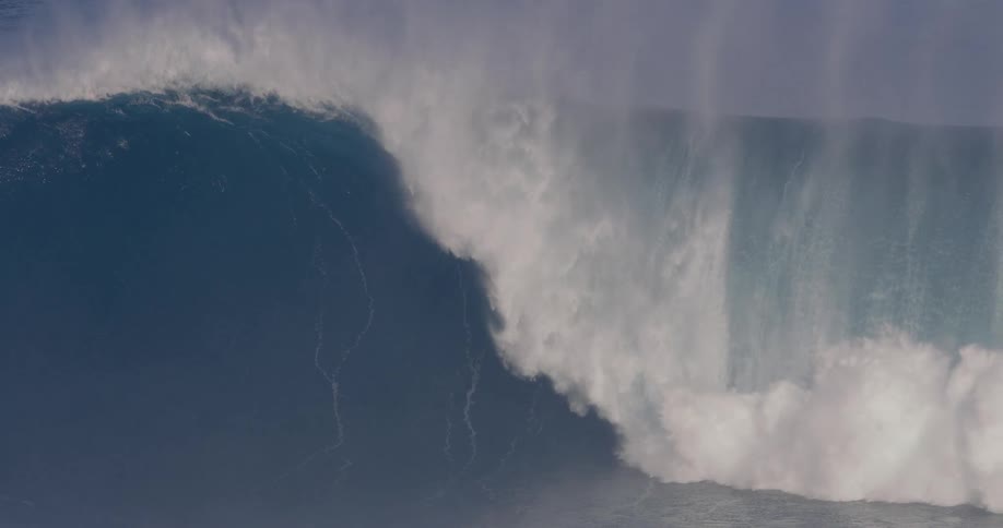 Yellow surfboard floating on the ocean in the middle of a sea wave outdoors