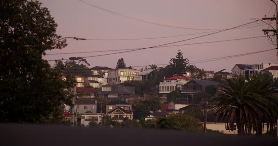 Residential neighborhood lit by soft dusk light