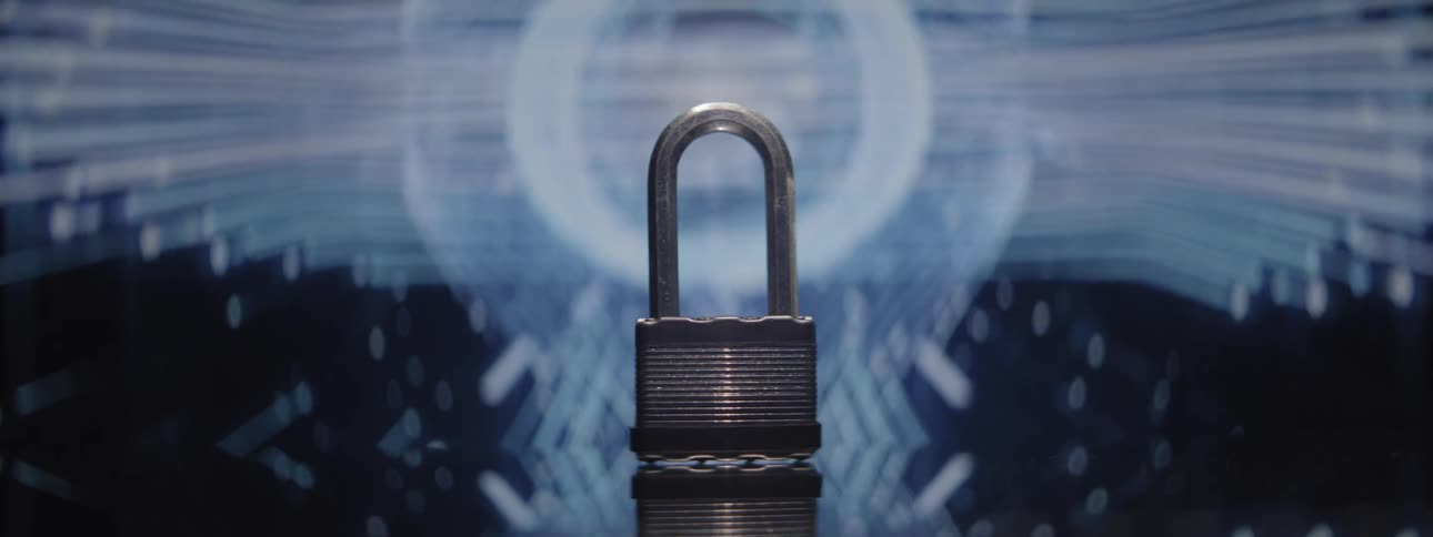 Metal padlock positioned in front of a background with blurred lights
