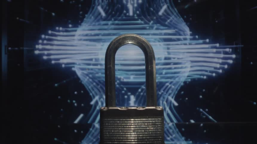 Close up of a metal padlock placed on a surface against a digital background