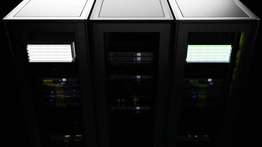 Aligned server racks displaying illuminated panels and organized cabling