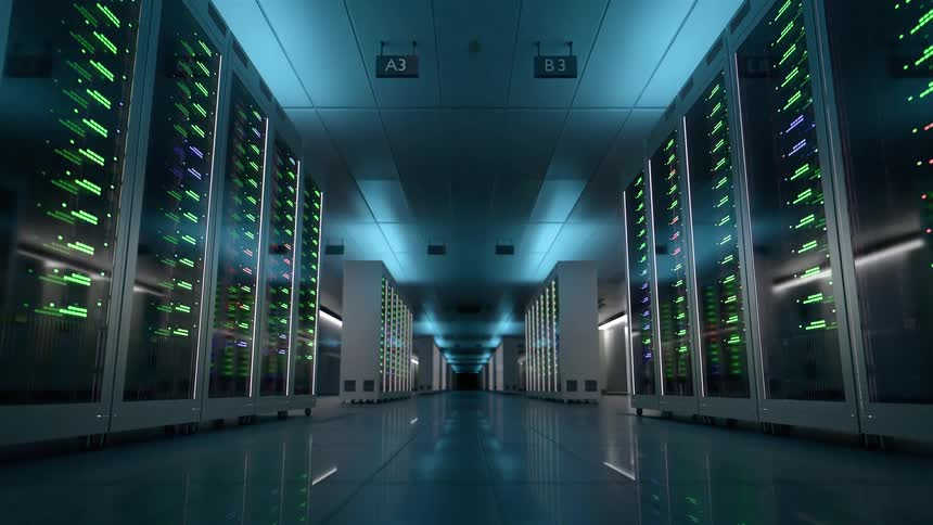 In a cool bluelit server room countless lights on rows of data racks blink and flash rapidly their glow reflecting off the polished floor