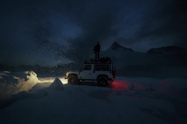 Woman standing on top of an off-road 4x4 during a winter snowstorm, cinematic night shot with blowing snow and slow camera move