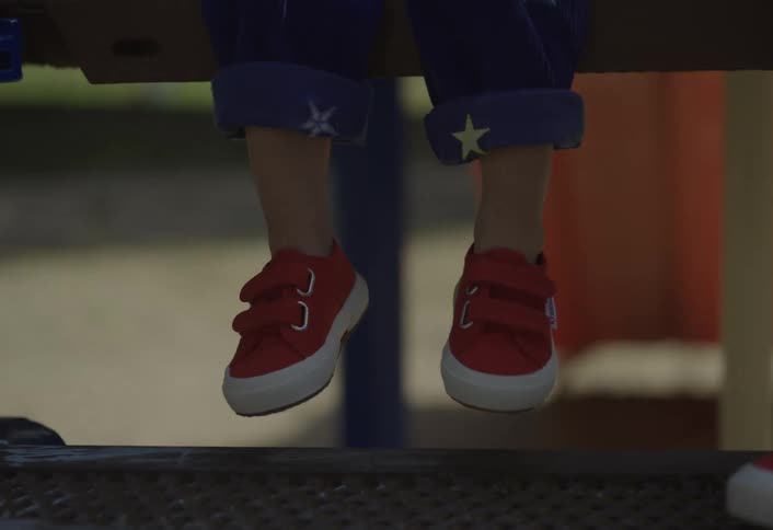 Shoes on the feet of children on their porch