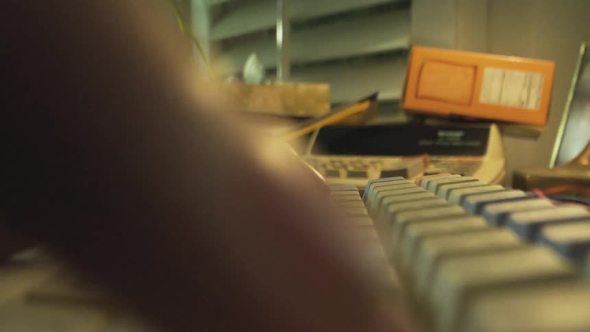 Fingers typing on a computer keyboard