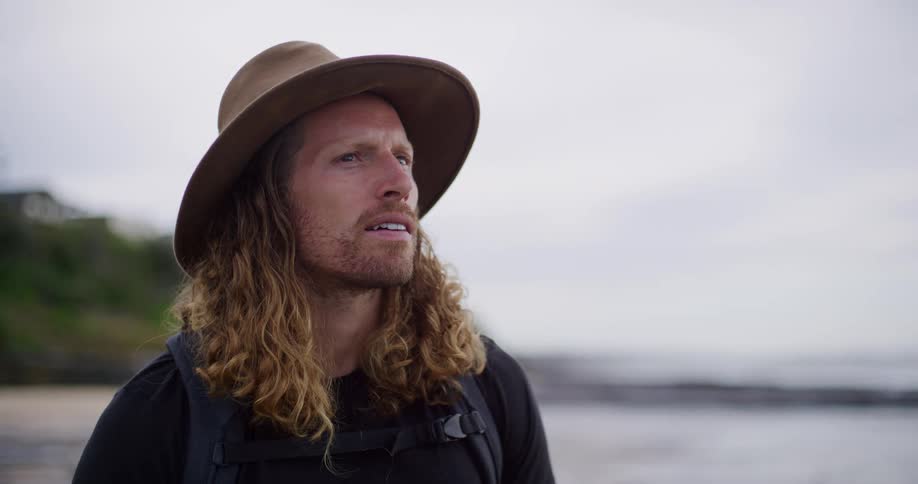 A portrait of a man standing outdoors