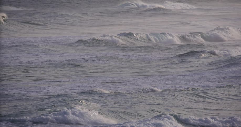 Successive waves moving across rough sea