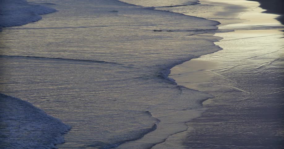 A view of waves washing onto the shore
