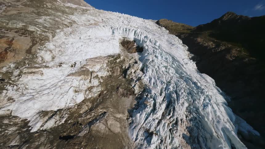 The side of the mountain is covered with ice