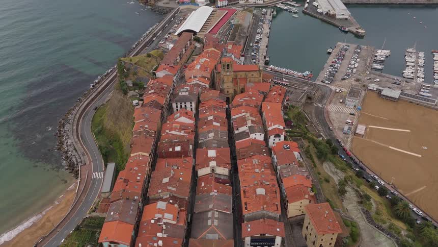Homes are next to the harbor full of boats