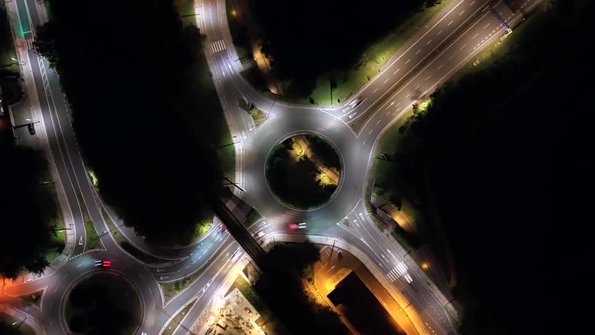 Central roundabout lit by urban lights at night