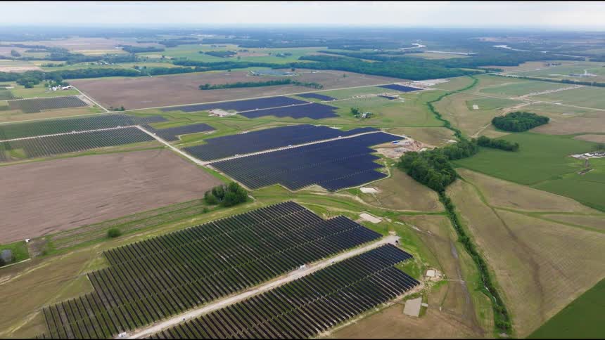 The landscape is covered with solar panels